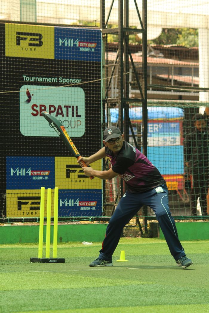 services-01 Exciting cricket action as a batsman prepares to strike on a vibrant turf field.